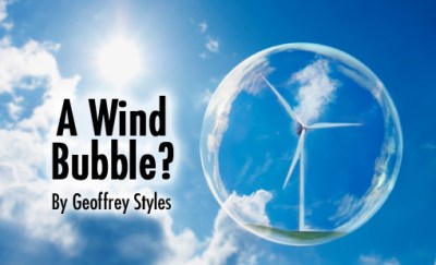 Floating Soap Bubble Against Clear Sunlit Blue Sky and Clouds