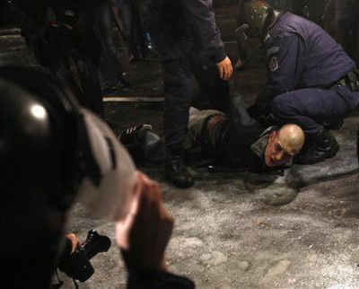 A man is detained by police during a protest against high electricity prices in Sofia