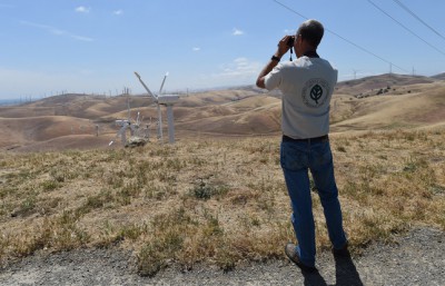 Doug Bell, wildlife program manager for East Bay Regional Park District, looks for golden eagles from the mothballed Tres Vaqueros wind farm in the Altamont area of Contra Costa County, Calif., on Friday, May 8, 2015. Questions remain regarding many birds are killed on the Altamont Pass by the wind turbines. The number of estimated deaths due to the turbines ranges from zero to about 6,000 per year. This includes birds of all species including golden eagles. A new "background mortality" study, which will come up with estimates on how many birds in the area might be dying from causes other than the turbines, will be released soon. (Dan Honda/Bay Area News Group)
